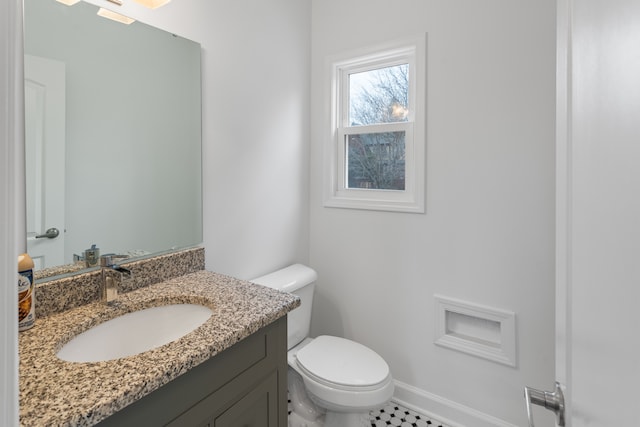 bathroom featuring vanity and toilet