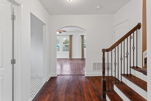 foyer with dark wood-type flooring