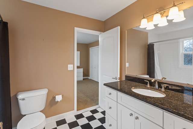 bathroom with vanity, toilet, and walk in shower