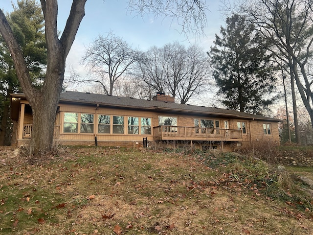 back of property featuring a deck