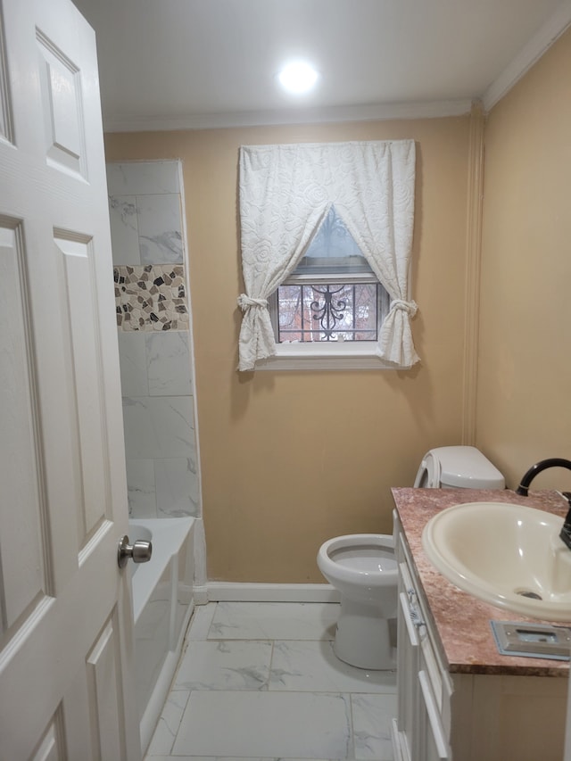 bathroom featuring ornamental molding, vanity, and toilet