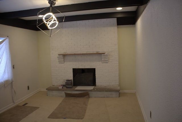 unfurnished living room with beam ceiling and a fireplace