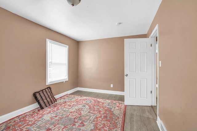 bedroom featuring hardwood / wood-style floors