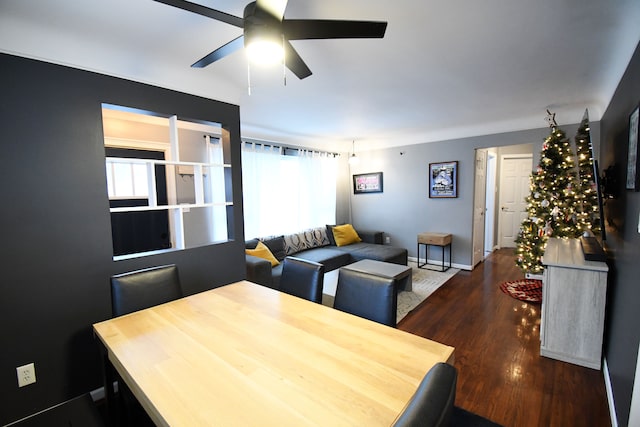 dining space featuring dark hardwood / wood-style floors and ceiling fan