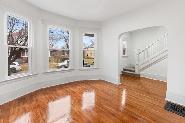 unfurnished dining area featuring hardwood / wood-style flooring