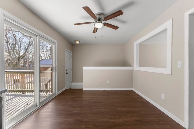 unfurnished room featuring ceiling fan and dark wood-type flooring