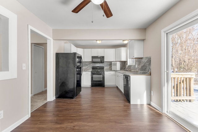 kitchen featuring ceiling fan, dark hardwood / wood-style floors, decorative backsplash, white cabinets, and black appliances