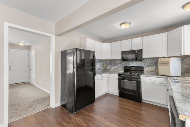 kitchen with backsplash, white cabinets, black appliances, and dark hardwood / wood-style floors