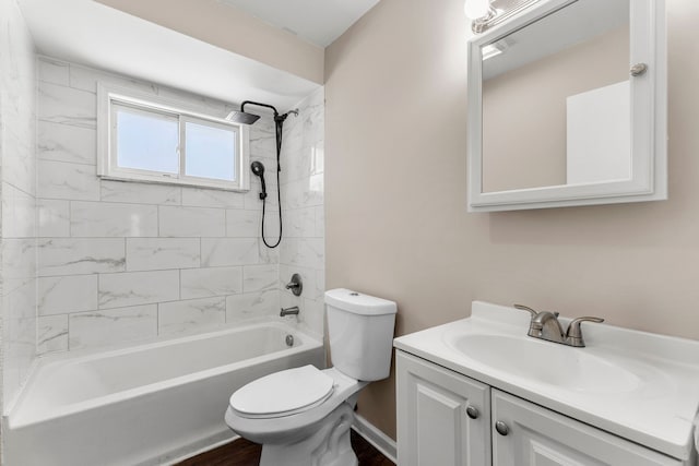 full bathroom with toilet, vanity, and tiled shower / bath combo