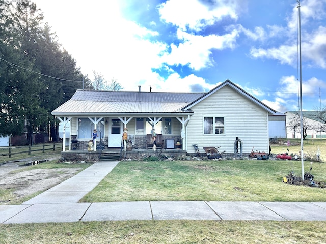 view of front facade with a front yard and a porch