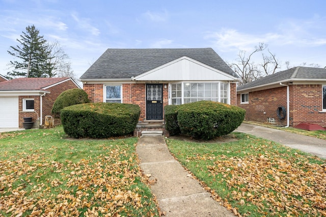 bungalow-style home featuring a front yard