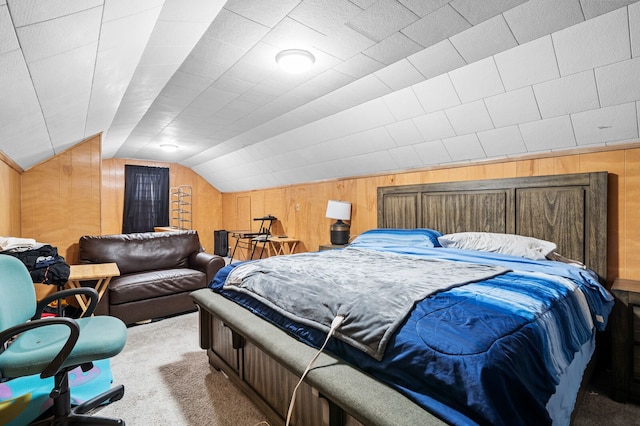 bedroom featuring light carpet, vaulted ceiling, and wood walls