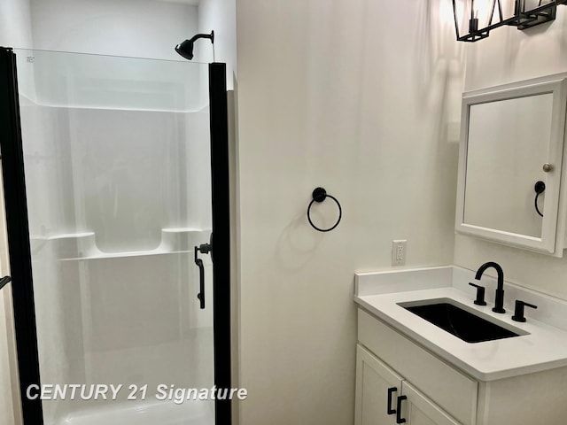 bathroom with vanity and walk in shower