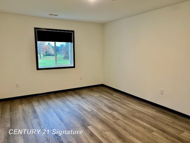 unfurnished room featuring light hardwood / wood-style flooring