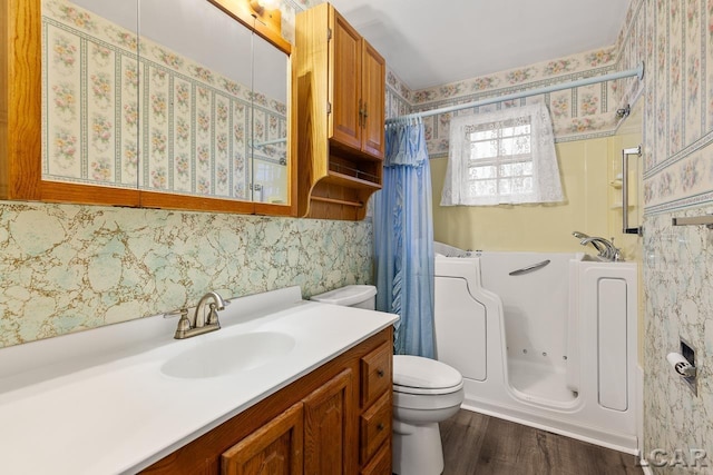 full bathroom featuring vanity, toilet, wood-type flooring, and shower / bath combo