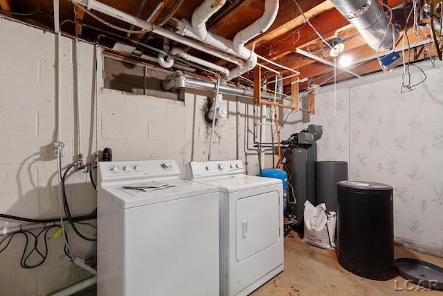 clothes washing area featuring washing machine and clothes dryer