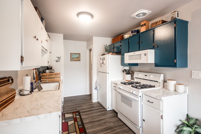 kitchen with dark hardwood / wood-style floors, sink, white appliances, and blue cabinets