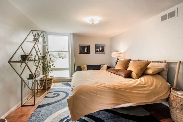 bedroom featuring wood-type flooring