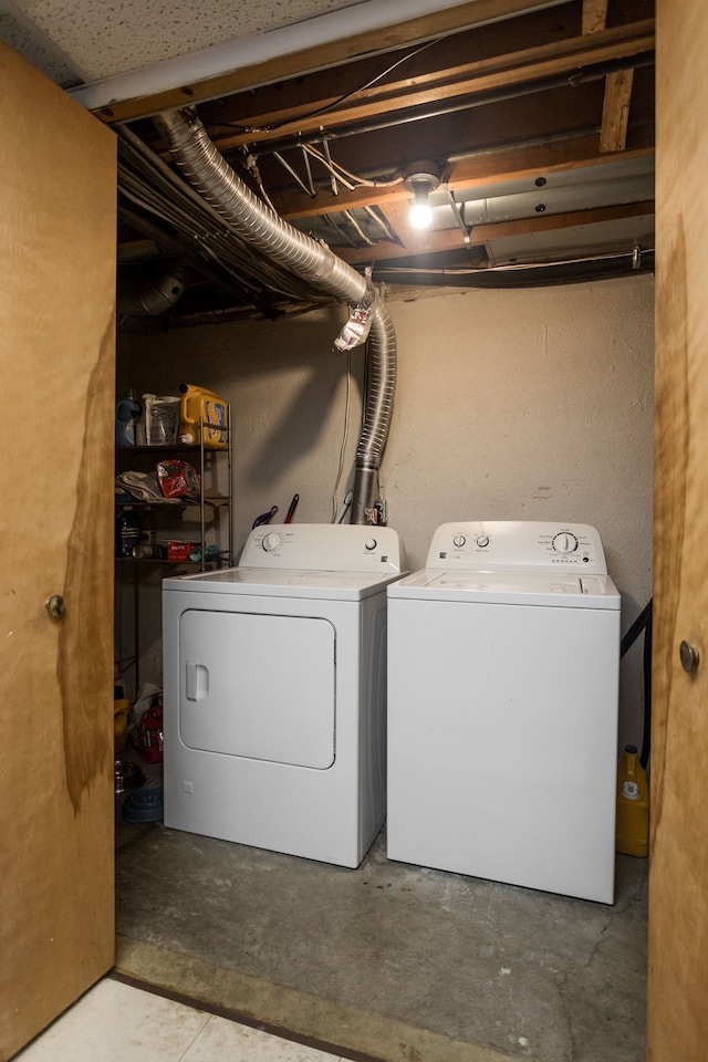 clothes washing area featuring washing machine and clothes dryer