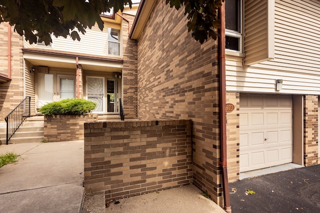 doorway to property featuring a garage