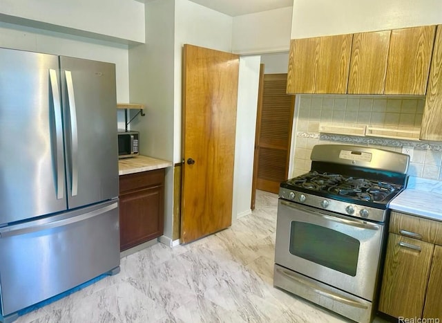 kitchen featuring tasteful backsplash and appliances with stainless steel finishes