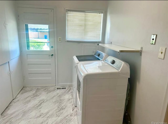 washroom featuring washer and clothes dryer