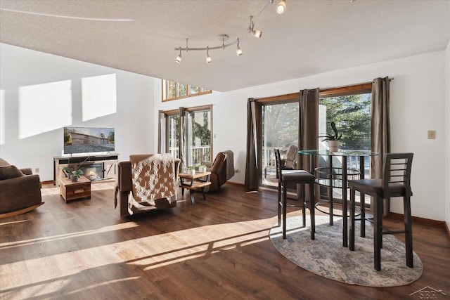 interior space featuring a textured ceiling and hardwood / wood-style flooring