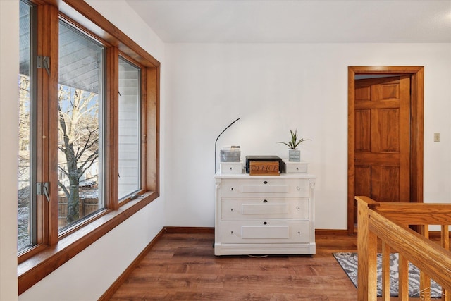 bedroom with dark hardwood / wood-style flooring