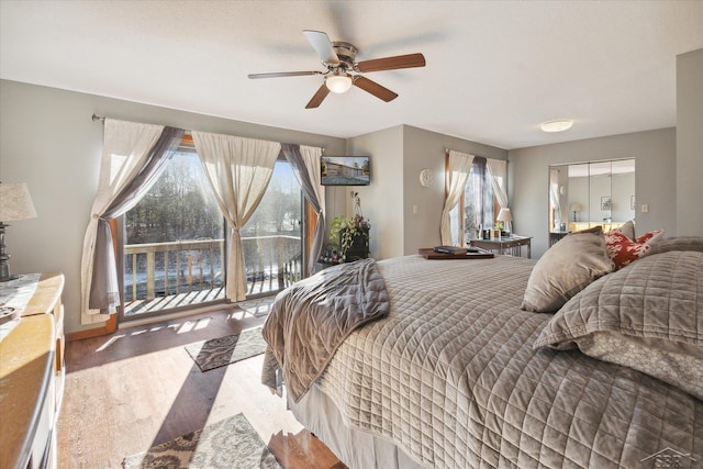856 Pawtucket Dr, Hope, MI 48628 - bedroom with access to outside, wood finished floors, baseboards, and a ceiling fan
