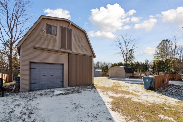 856 Pawtucket Dr, Hope, MI 48628 - snow covered garage featuring a garage