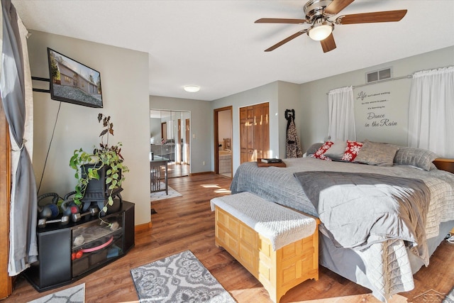 bedroom with hardwood / wood-style flooring and ceiling fan