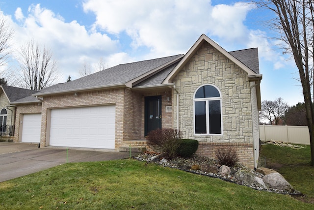 view of front facade featuring a front yard and a garage