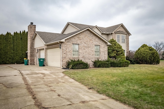 view of front of property featuring a garage and a front yard