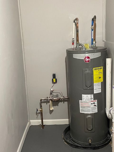 utility room with electric water heater