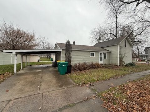 view of property exterior featuring a carport