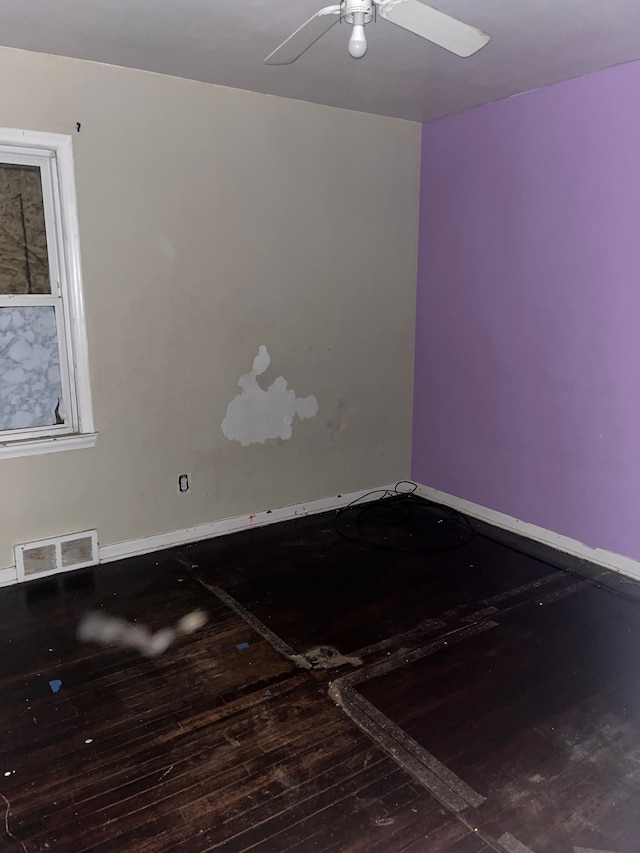 spare room featuring ceiling fan and hardwood / wood-style flooring