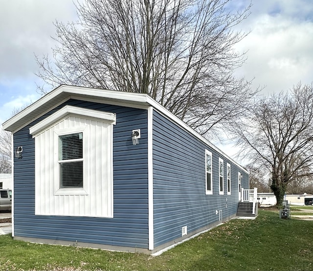 view of home's exterior featuring a lawn