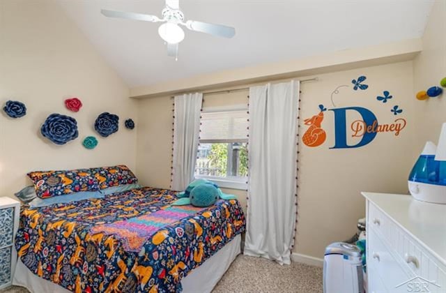 bedroom featuring light carpet, vaulted ceiling, and ceiling fan