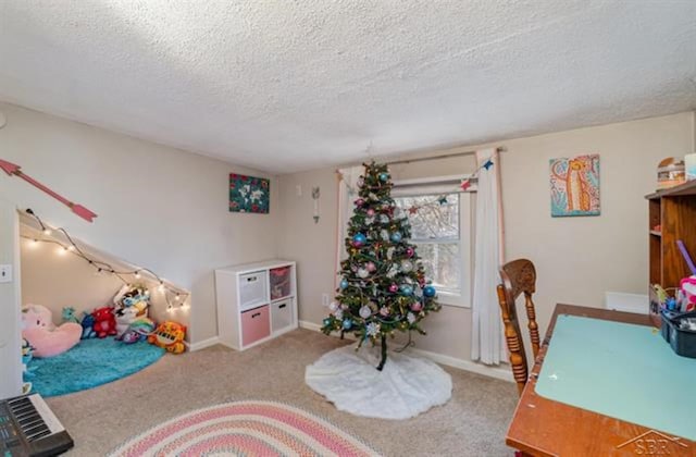 game room featuring carpet flooring and a textured ceiling