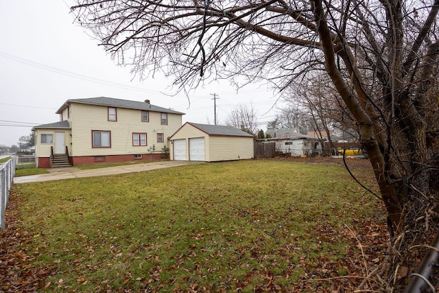 view of yard with a garage and an outdoor structure