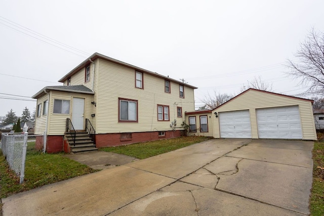 view of front of property with a garage and an outdoor structure