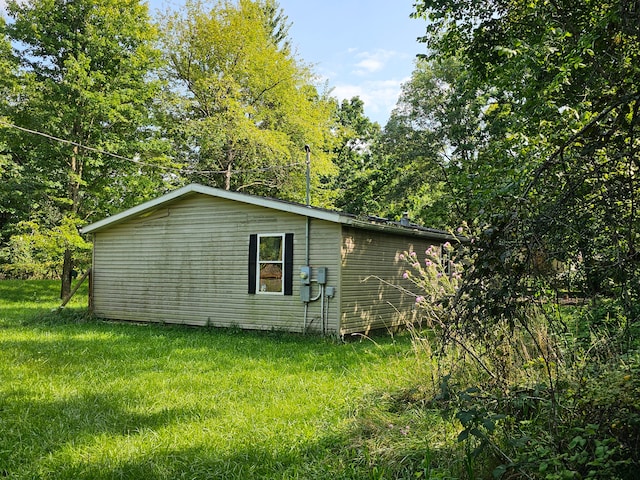 view of home's exterior featuring a yard