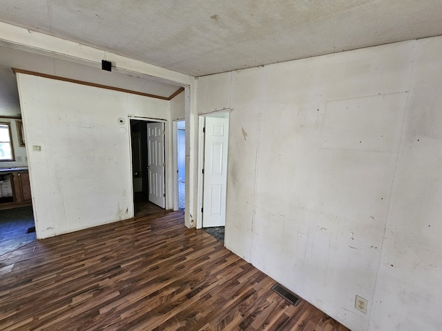 spare room with dark hardwood / wood-style flooring