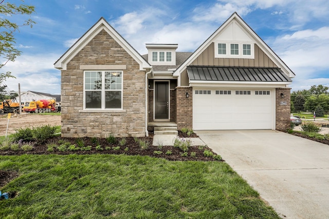 craftsman house with a garage and a front lawn