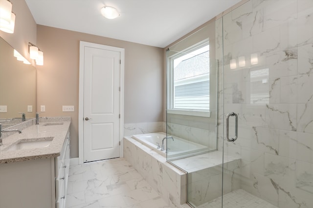 bathroom with vanity and separate shower and tub