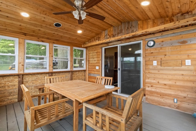 sunroom / solarium featuring ceiling fan, wood ceiling, and vaulted ceiling