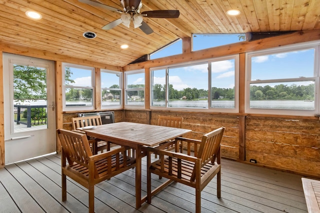 sunroom featuring a water view, vaulted ceiling, a wealth of natural light, and wood ceiling