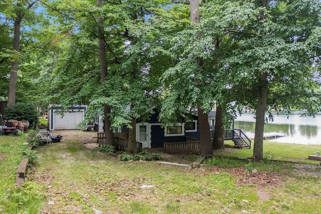 view of front of property featuring a front yard and a water view