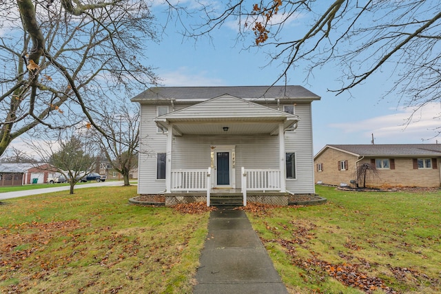 view of front of property with a front lawn and covered porch