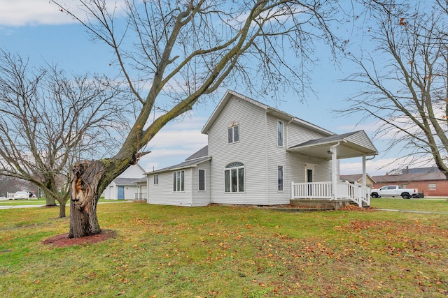 view of property exterior featuring a yard and a porch